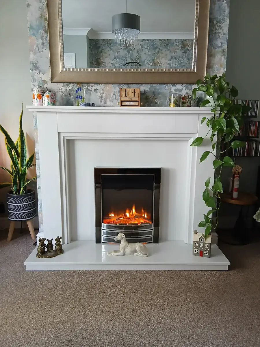 A fire set in a made-to-measure stone fireplace by Sontuoso Stone