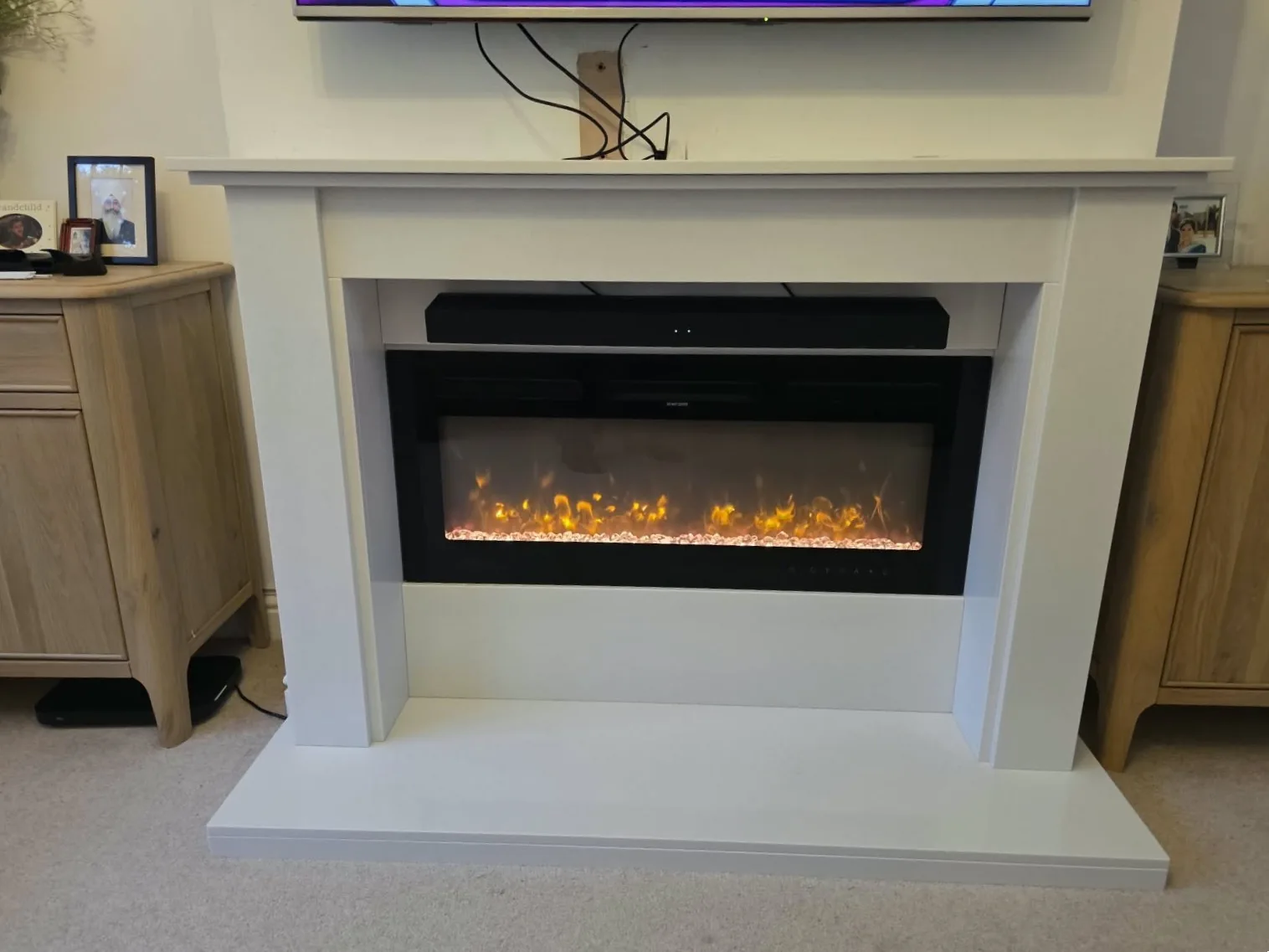 Completed Blanco Micro Marble surround fitted around the customer's existing wall-hung electric fire in Solihull