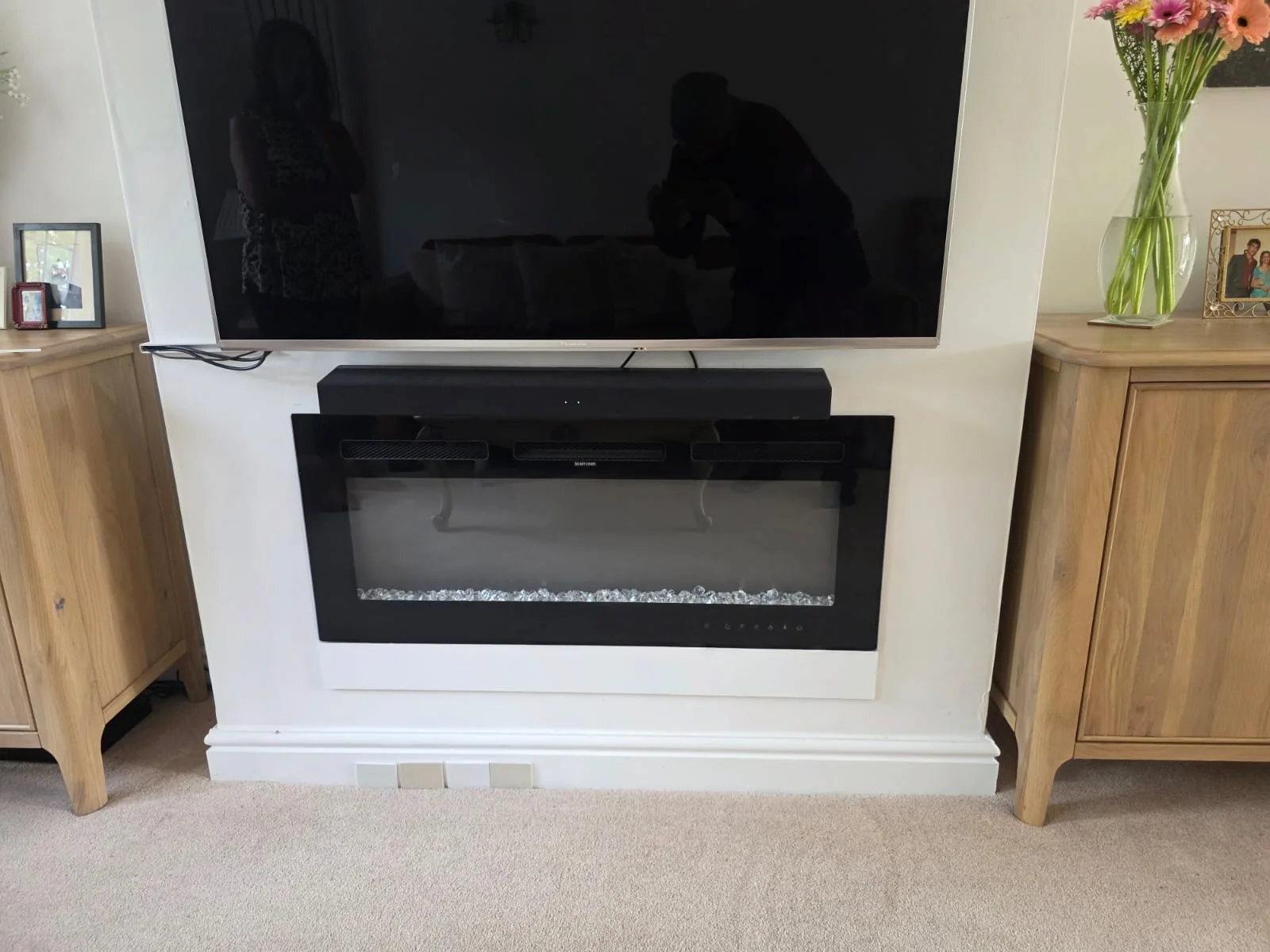 Before installation: the existing wall-hung electric fire without its new marble surround