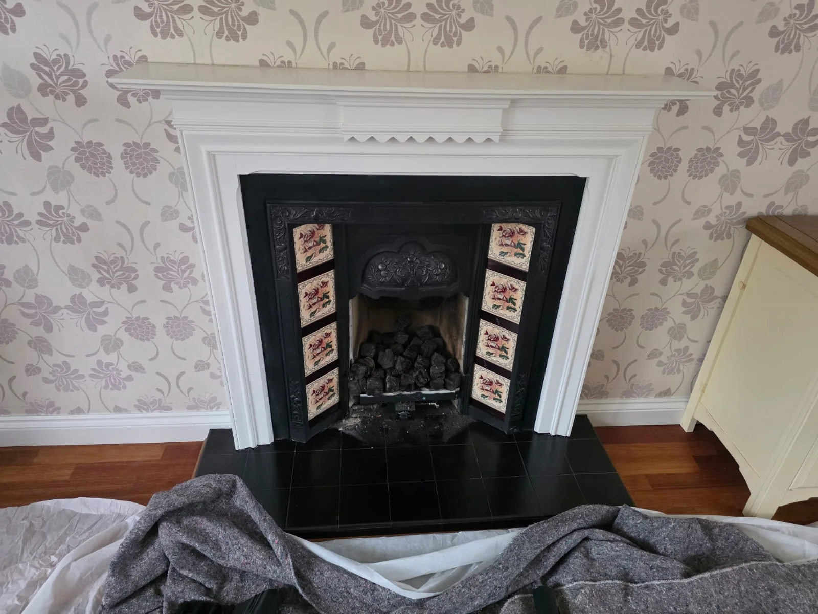 Before: the original cast iron fireplace in the same Solihull room